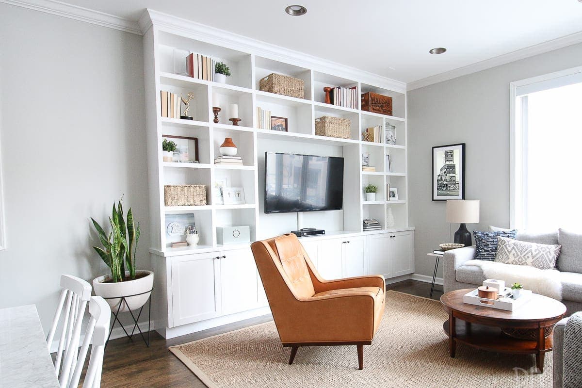 Our living room with the built-in's installed! Doesn't this floor to ceiling shelving look amazing?
