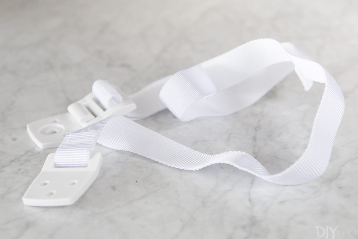 White furniture straps to babyproof your home and secure a leaning mirror to a wall.