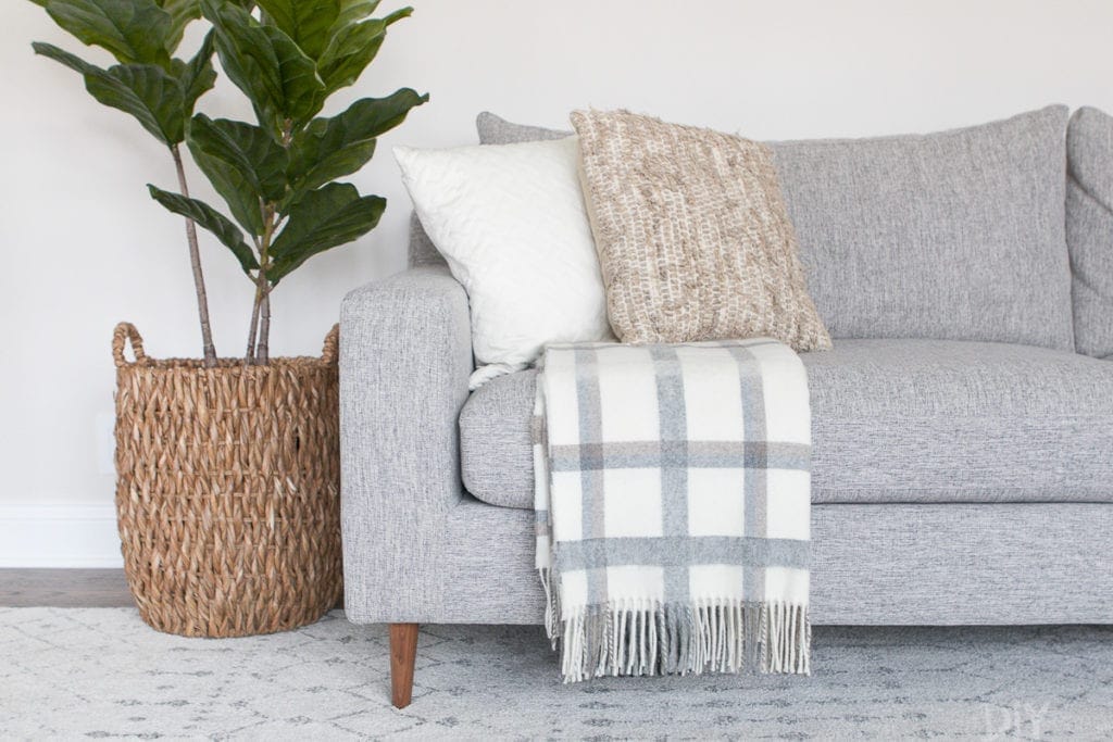 how to display blankets on couches
