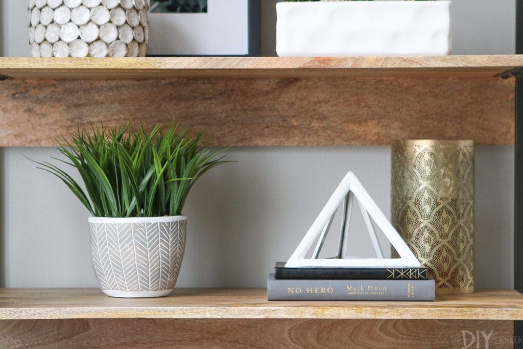 Use a wide variety of items to style bookshelves