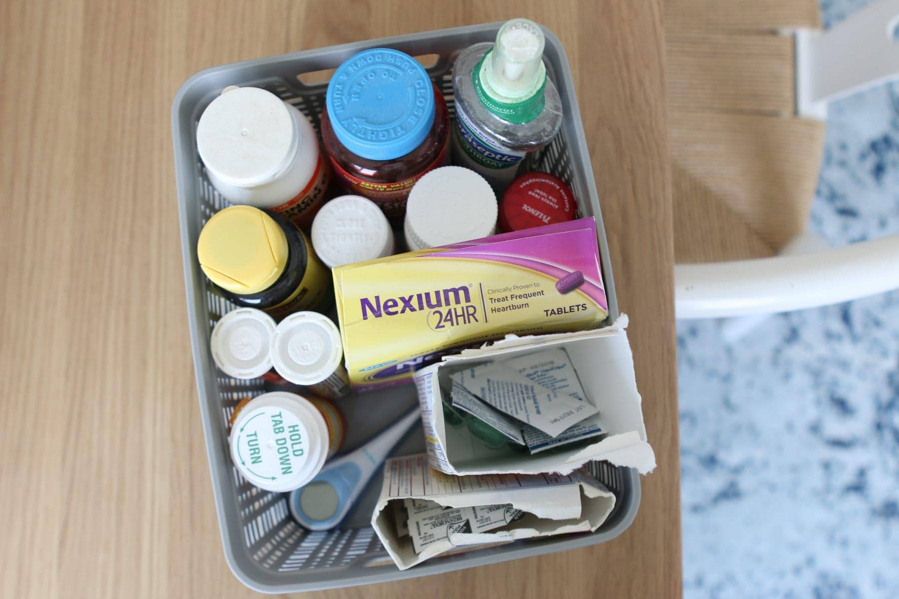 Organizing a linen closet with medicine container