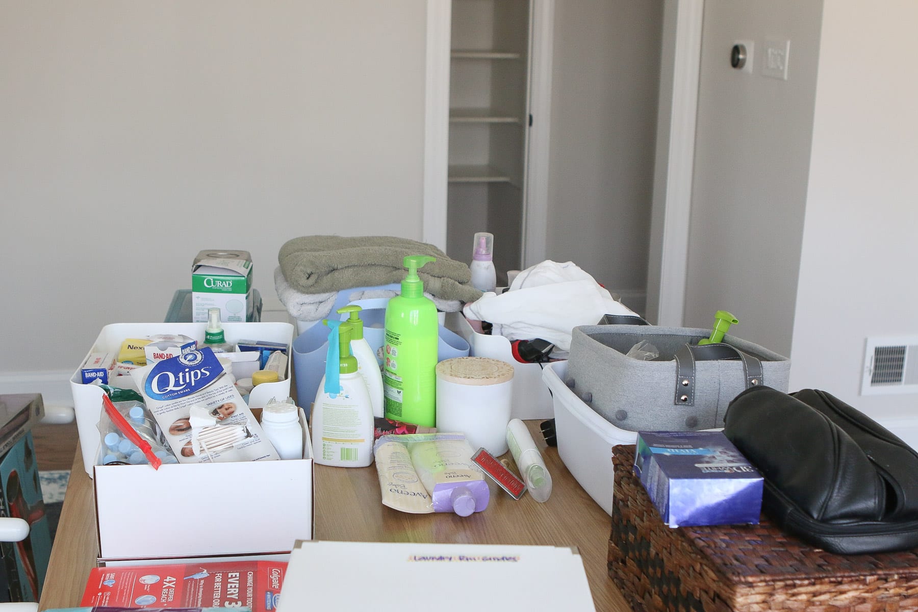 Organizing a linen closet by emptying it