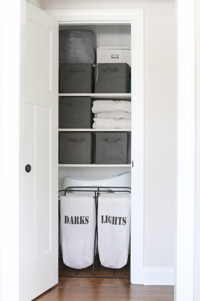 This organized linen closet holds lots of towels and organized laundry