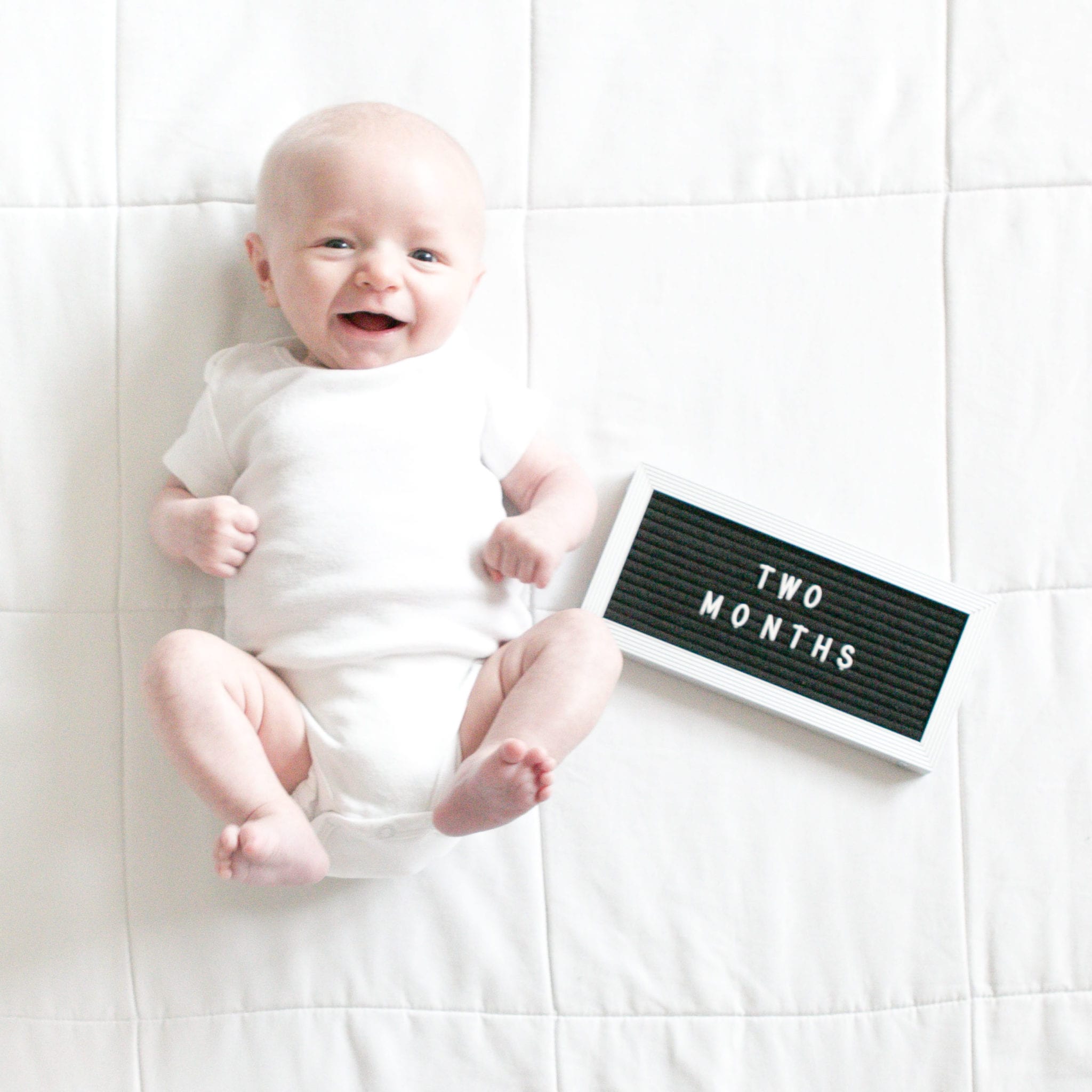 newborn photos with letterfolk board