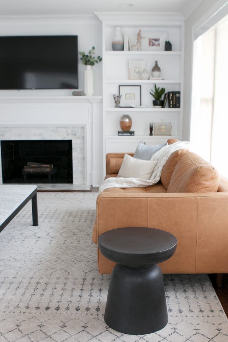 Round, drum, and black side table