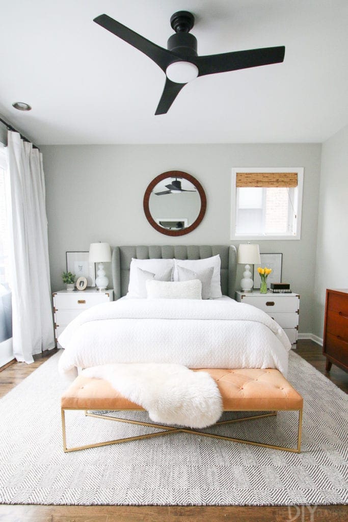 Gray bedroom with leather bench