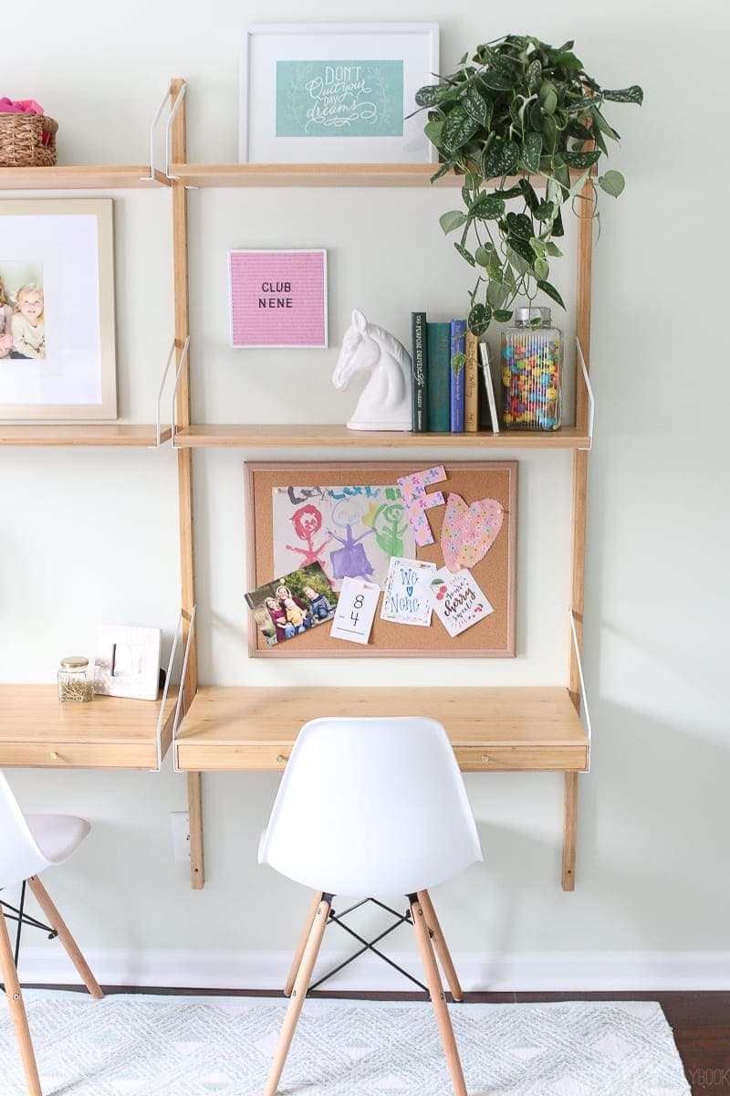 A desk area with storage and room for crafting. 
