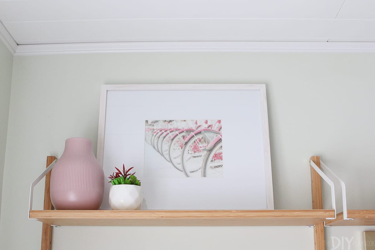 A framed photo of pink bicycles works perfectly in this kids' room 