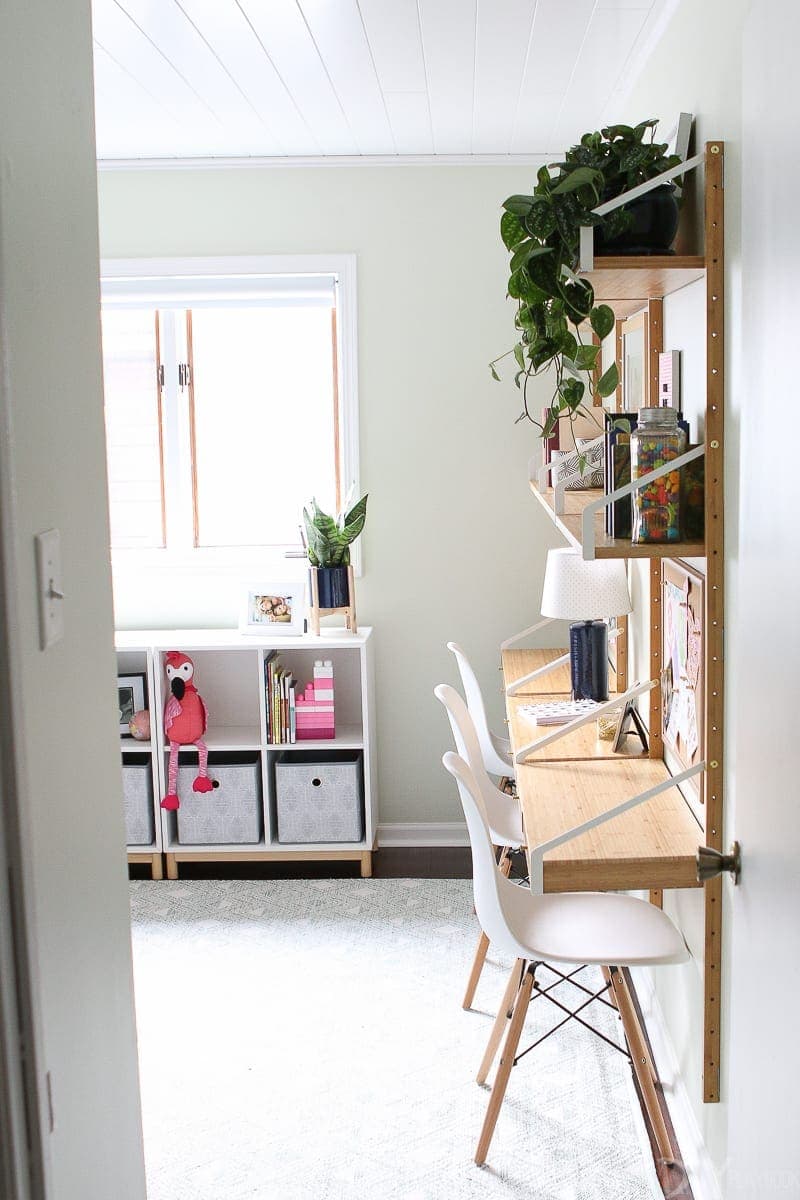 Consider adding a wall desk unit to keep things slim in a small room
