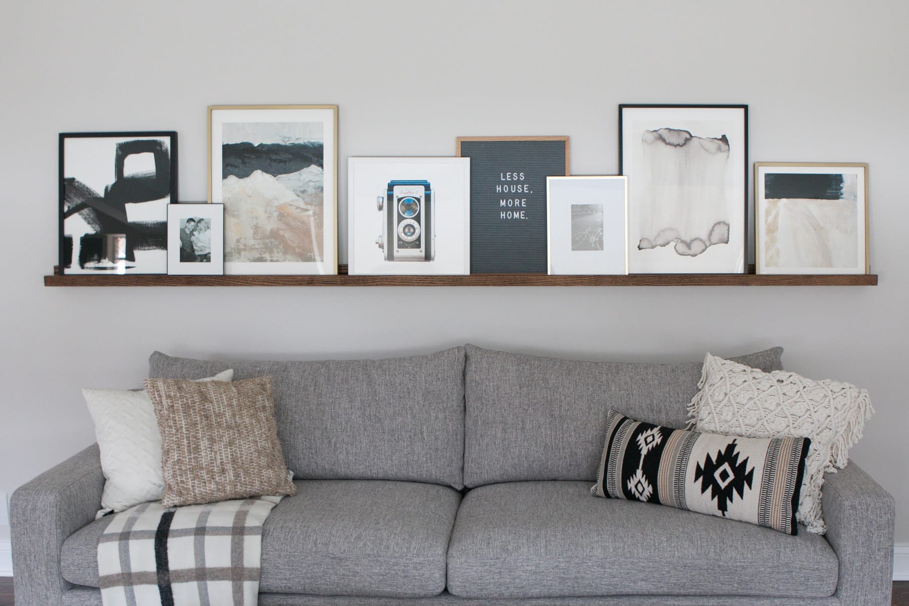 This DIY picture ledge is full of art pieces from Minted
