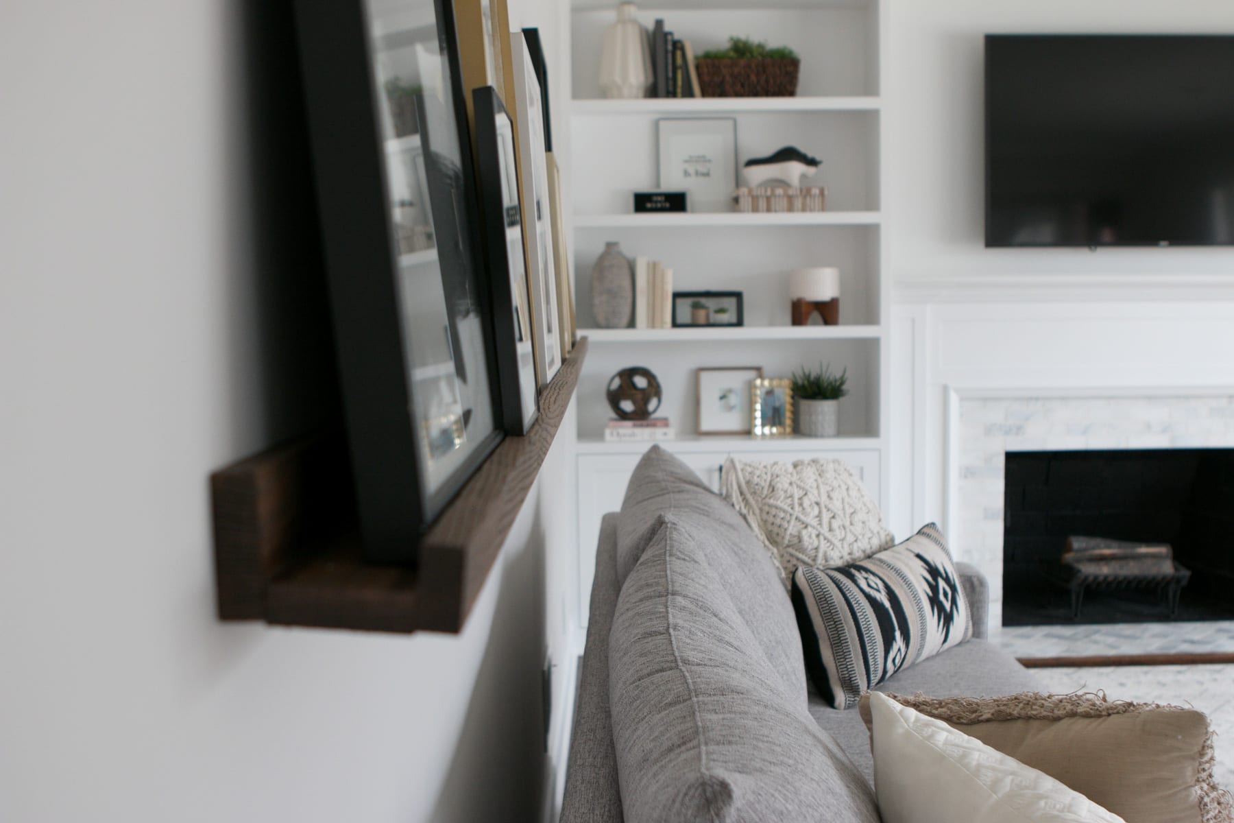 A DIY picture ledge jutting out from the wall. 