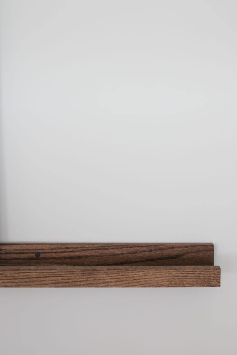 A DIY picture ledge stained the color dark walnut
