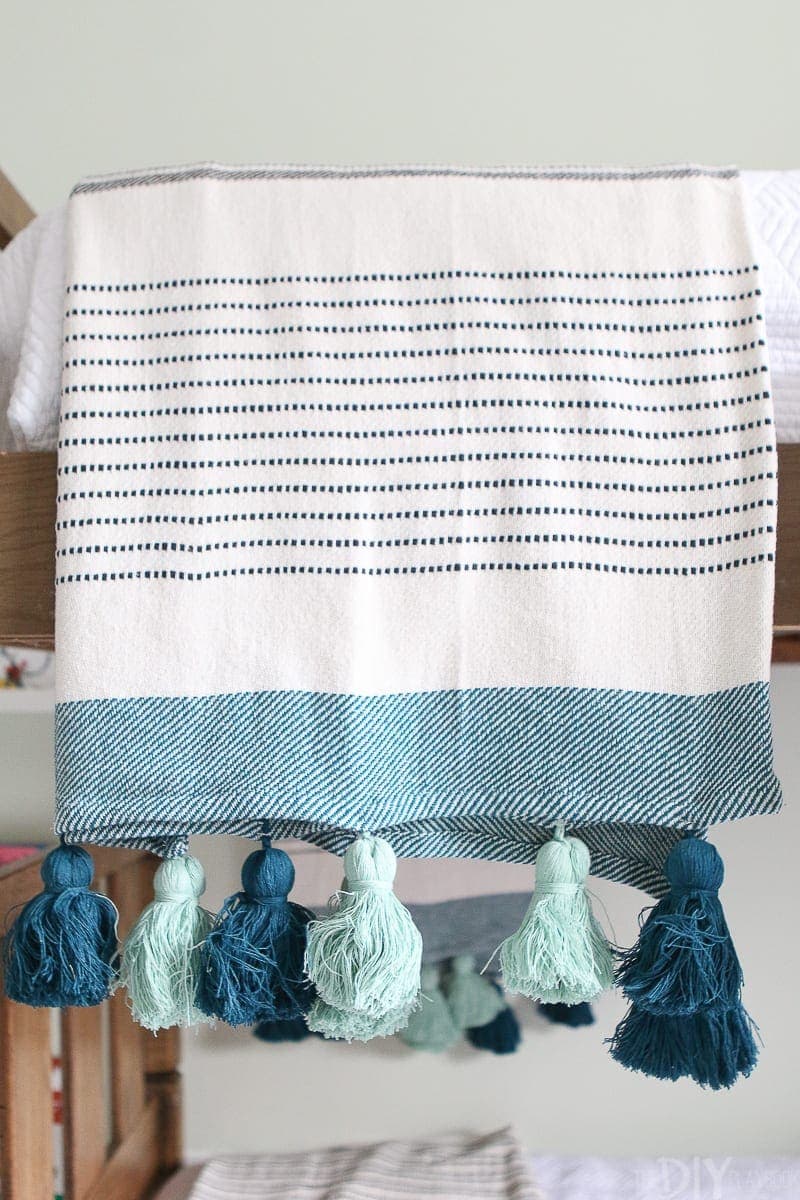 This tassel throw from the new Opahouse line at Target works perfectly in this kids' room makeover. 