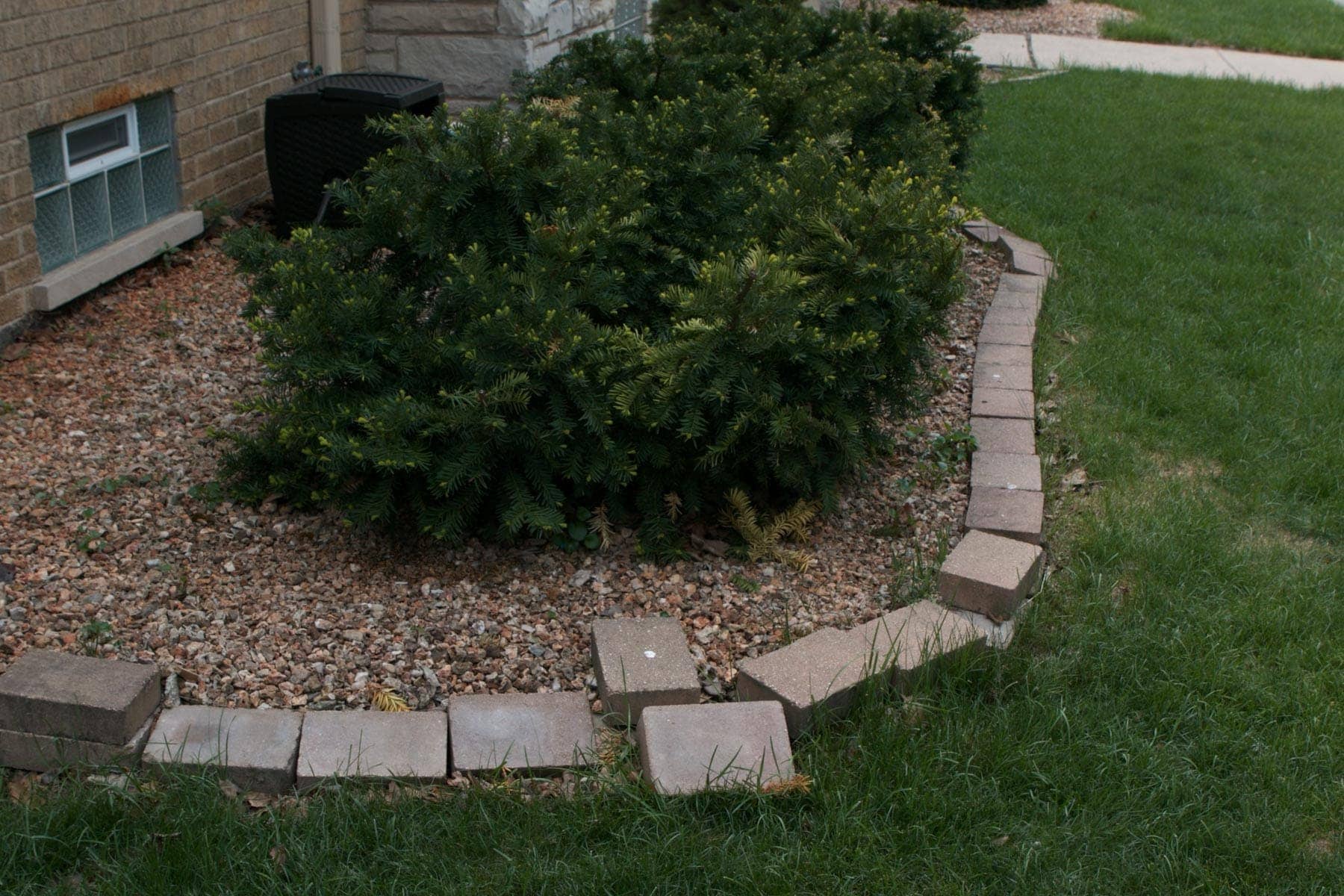 Pavers that are falling over in the grass 