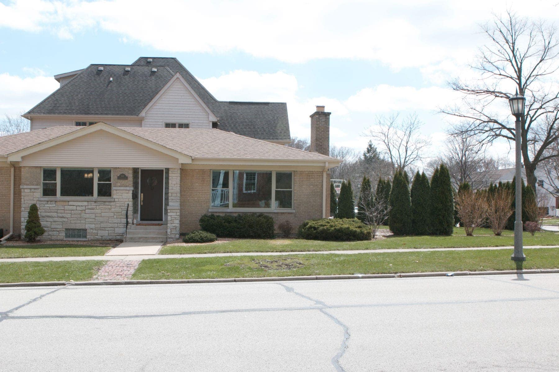 front of house with landscaping that needs makeover