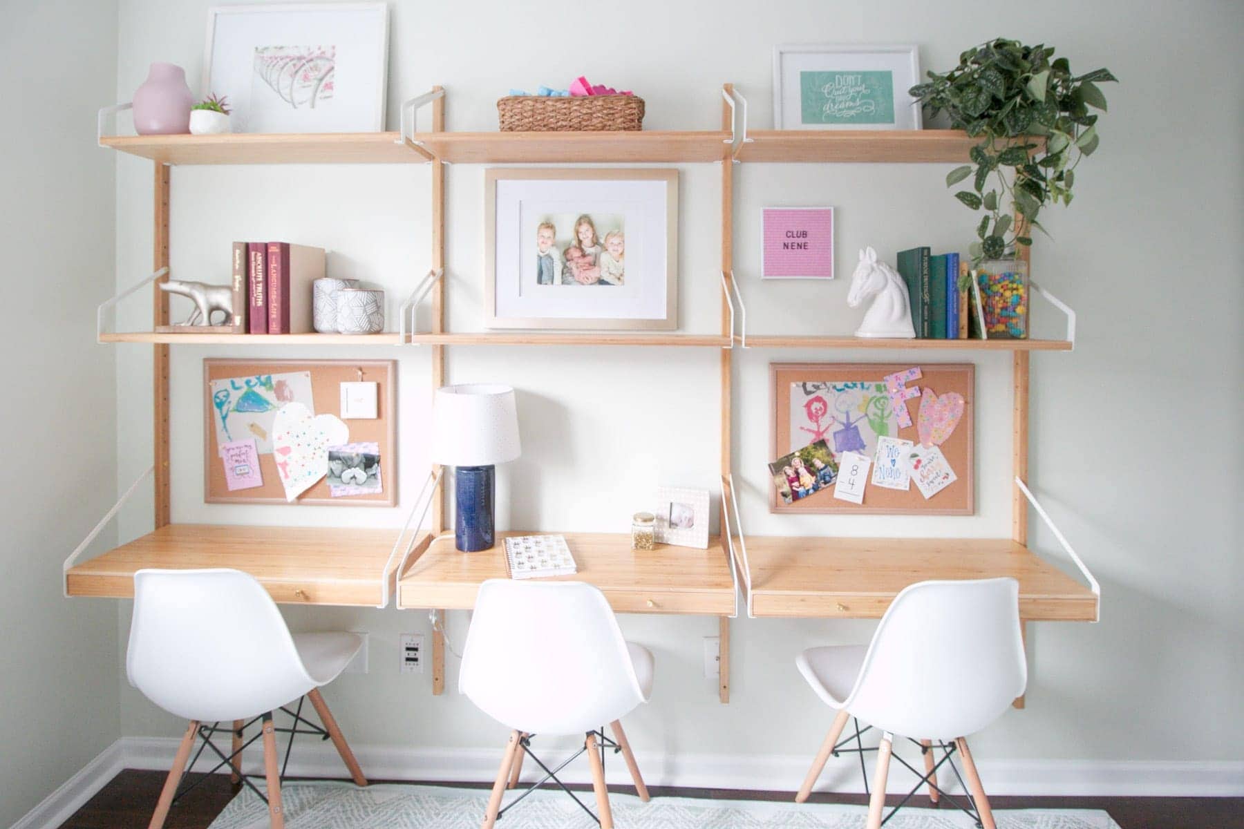 3 desks on a wall in this playroom
