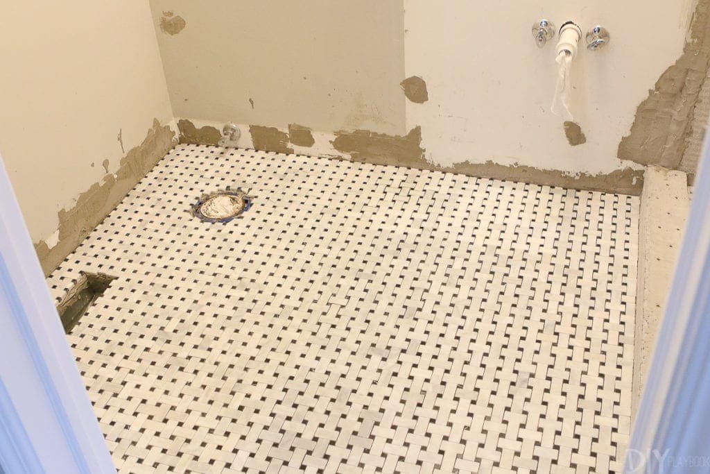 Lay down the tile and let it rest before grouting