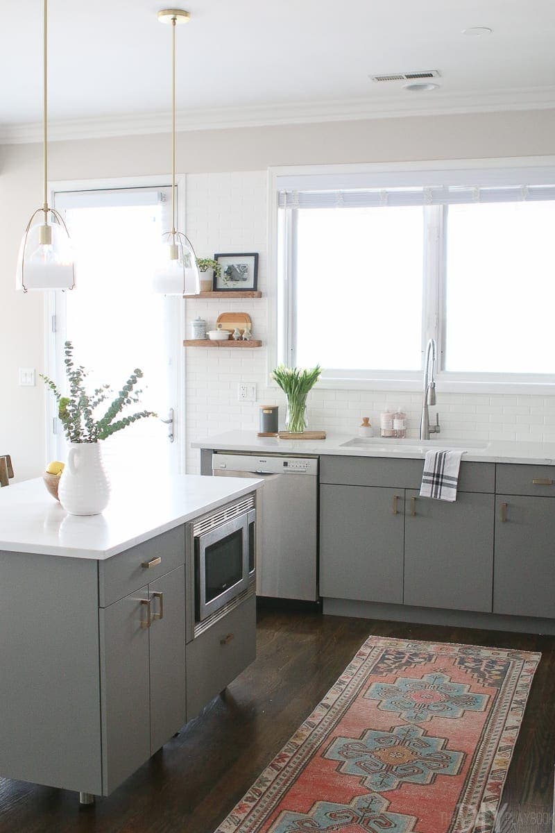 Love the gray cabinets and white subway tile in this kitchen space. 