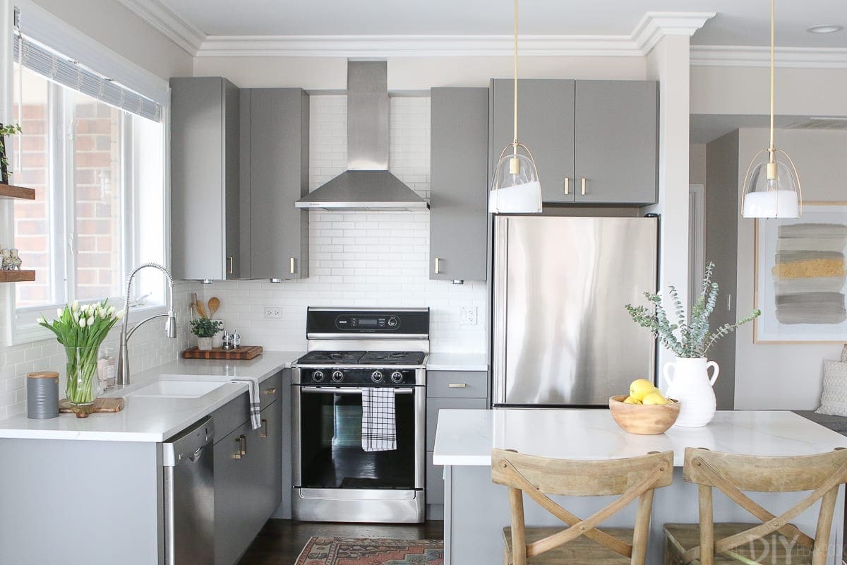 Brass accessories and hardware warm up this kitchen space. 