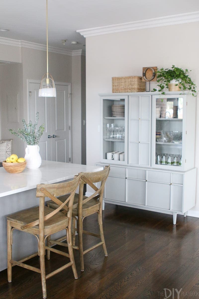 Use a painted hutch to store dishes in your small kitchen