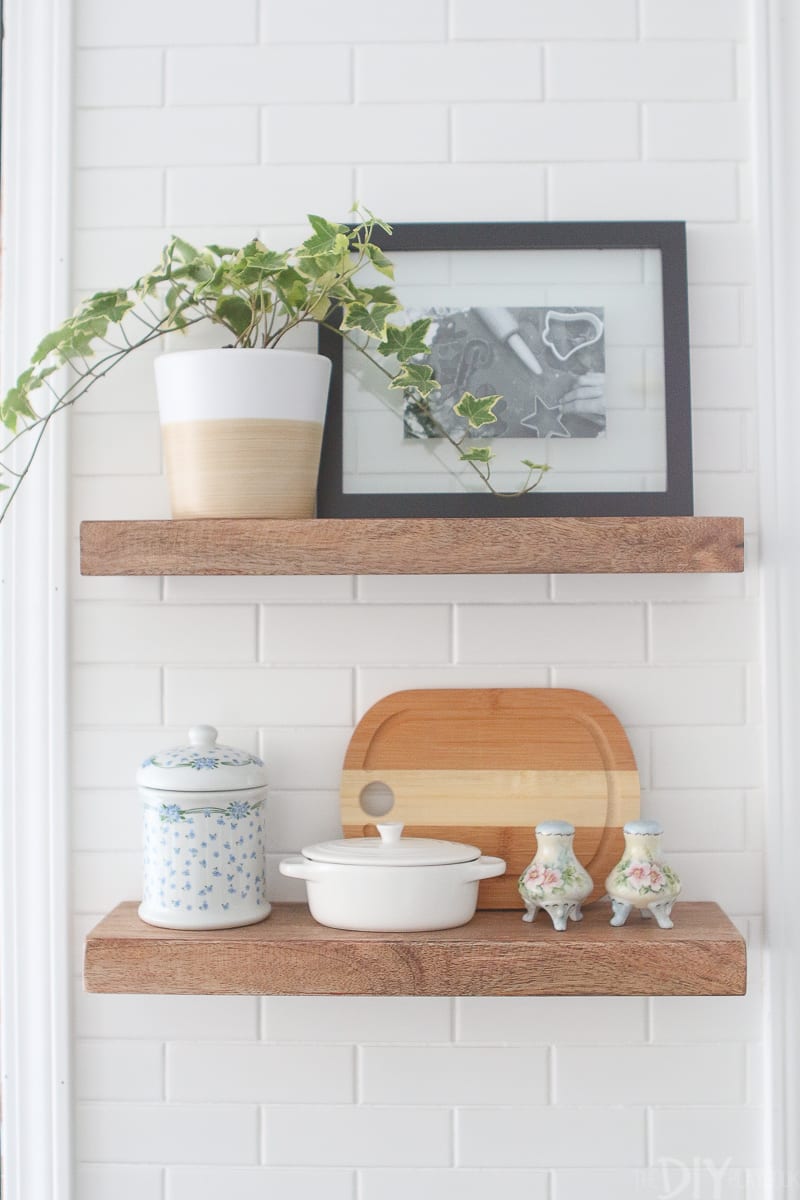 2 open shelves with kitchen accessories. 