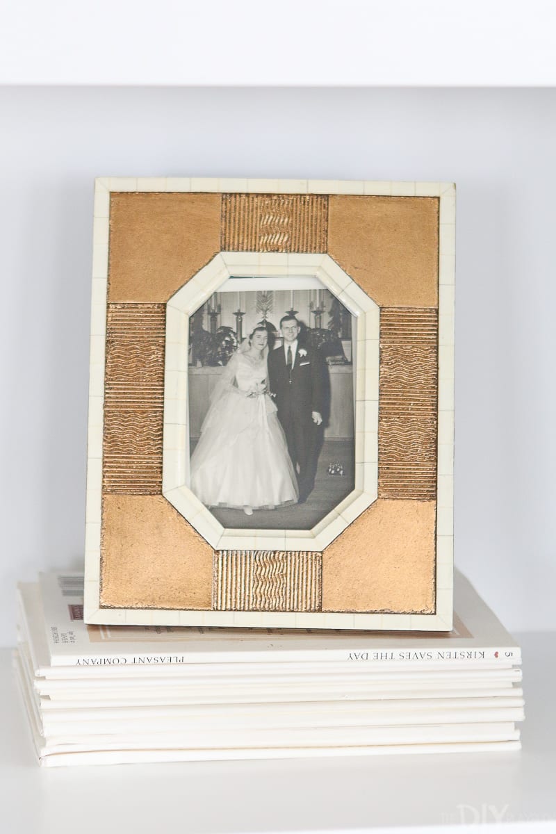 Frame an old family photograph in a brass frame. 