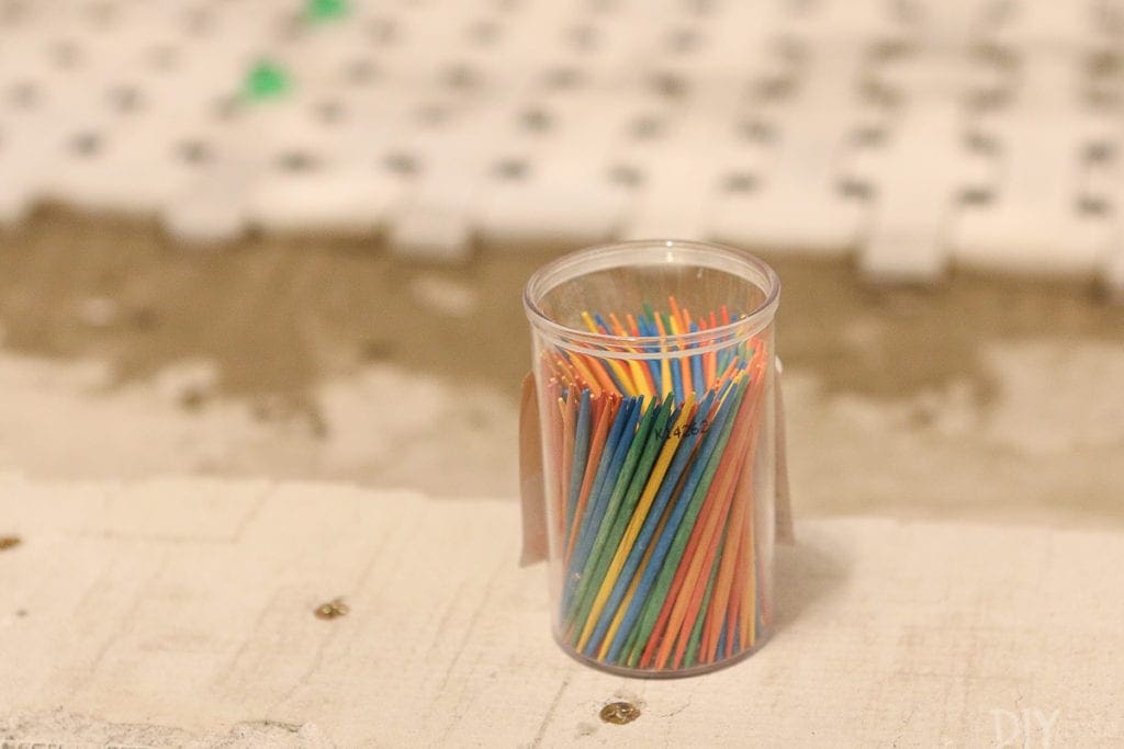 Toothpicks come in handy to get the thinset out of the cracks