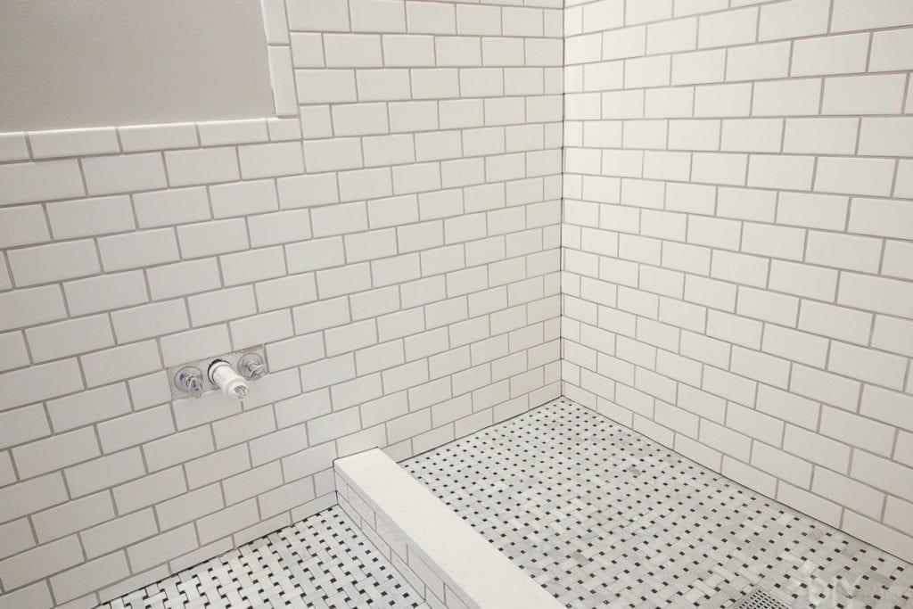 Marble basketweave floor tile in the bathroom
