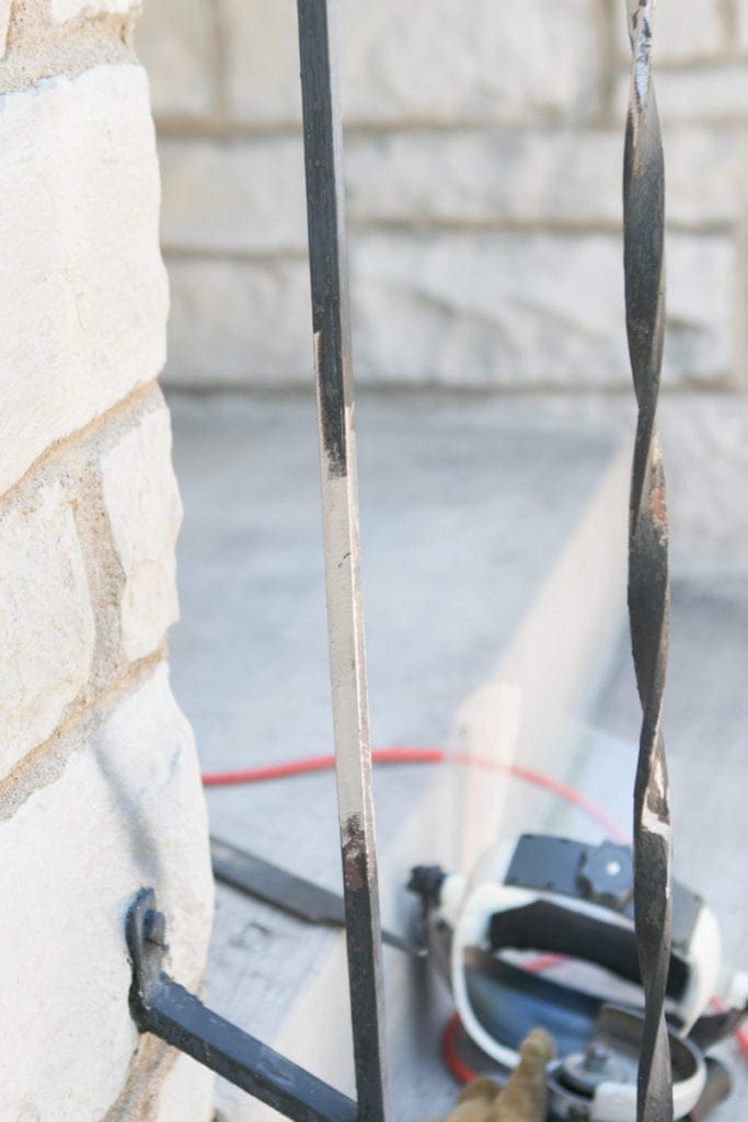 filing down a steel railing