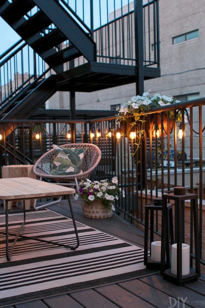 String lights add a soft glow to this outdoor patio space