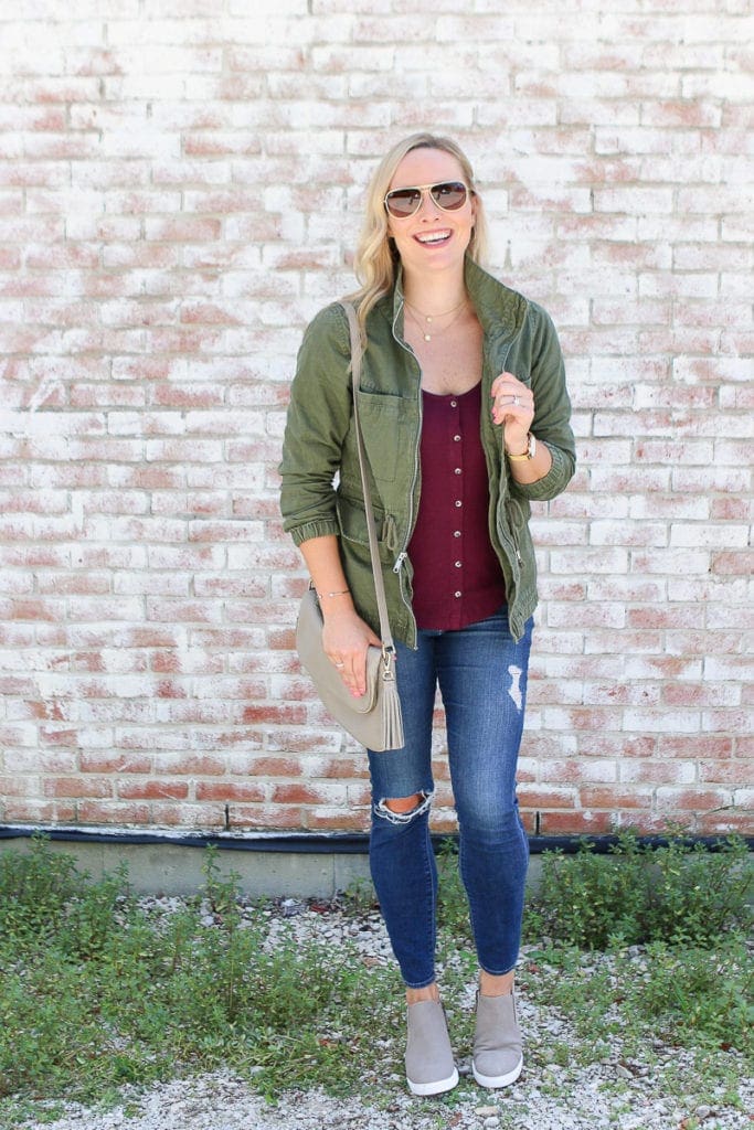 Layer a jacket over a blouse for a cozy fall look