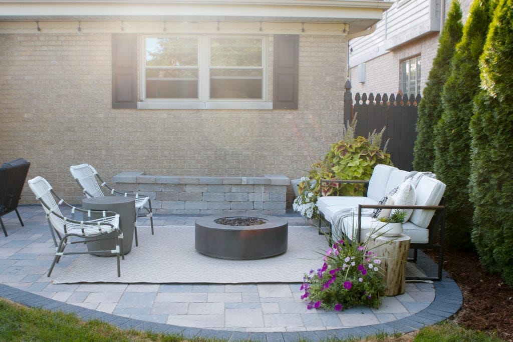 patio transformation with firepit and flowers