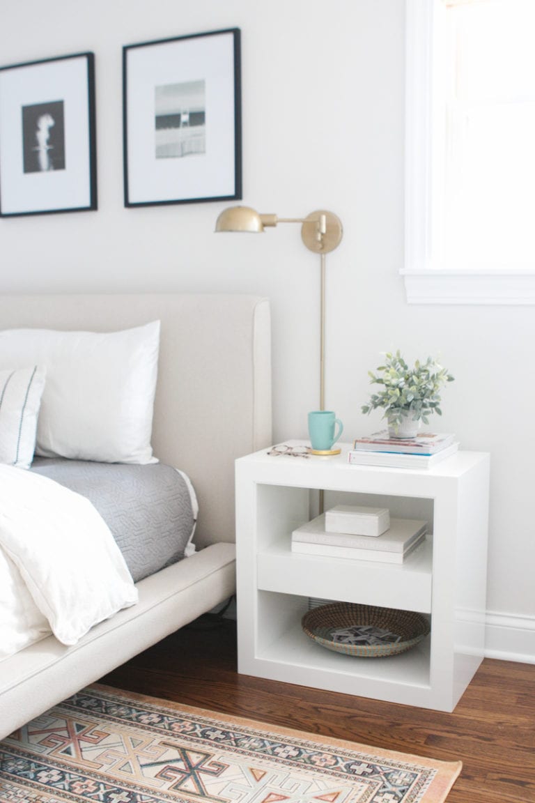 Gold sconces next to a bed