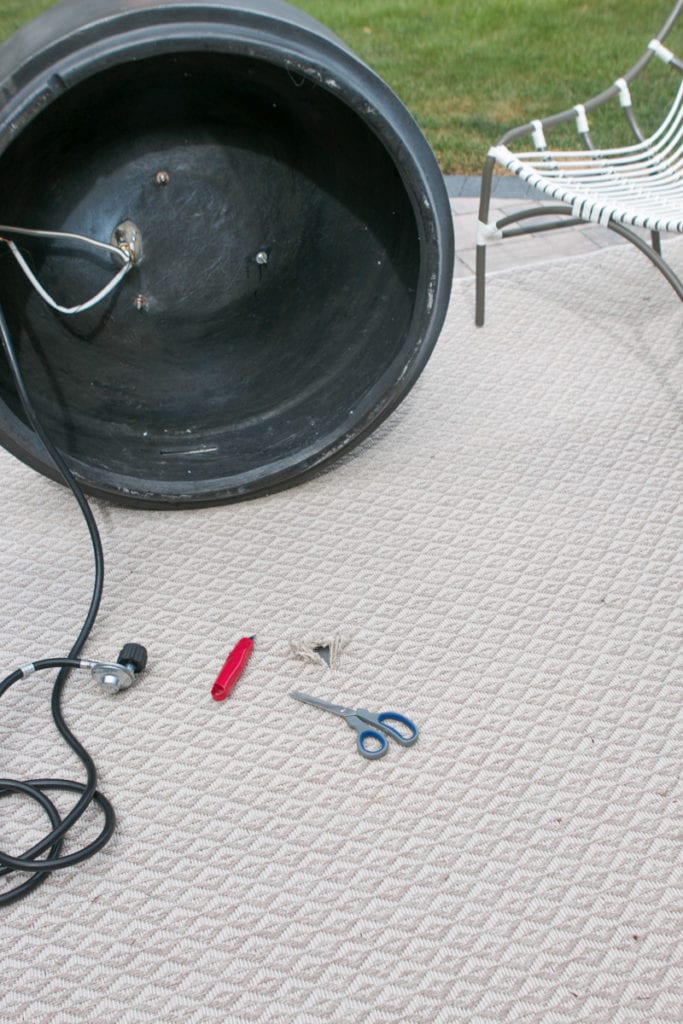 easy steps to hide a fire pit's propane tank 