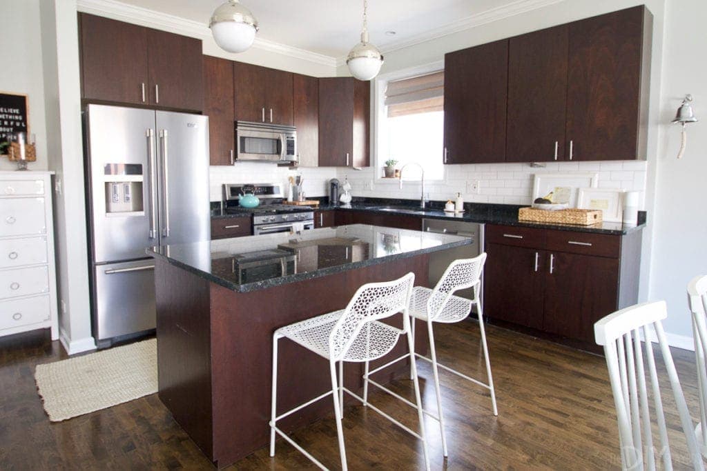 White mesh stools in a dark kitchen