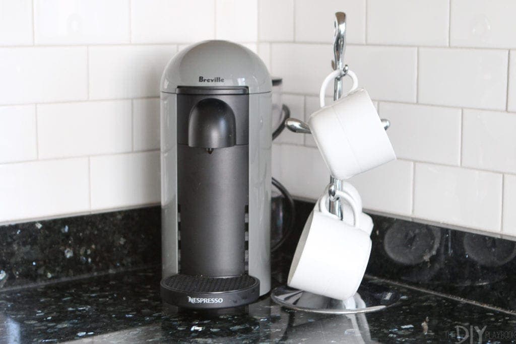 Nespresso machine with coffee cup tree