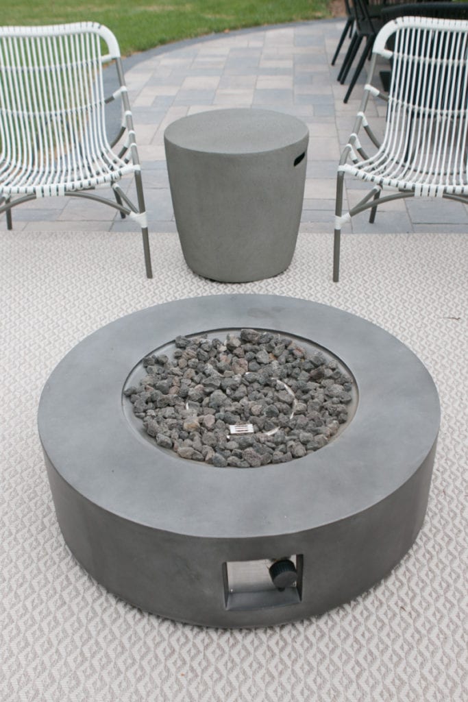hiding a modern fire pit propane tank in plain sight