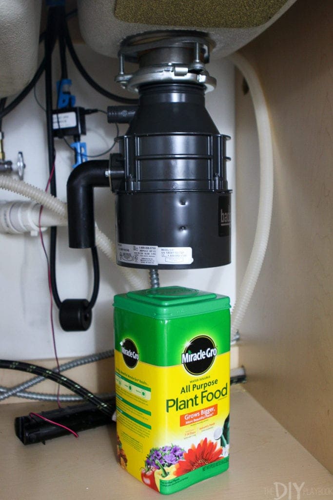 Mount the new garbage disposal