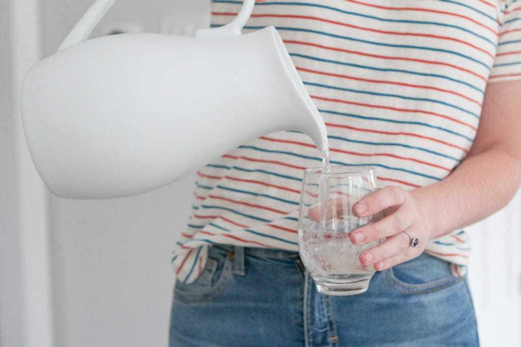 drinking water out of glass container