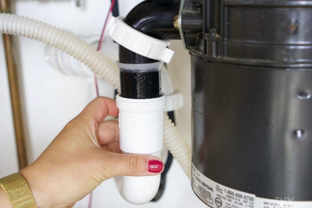 Remove drain tube on old garbage disposal