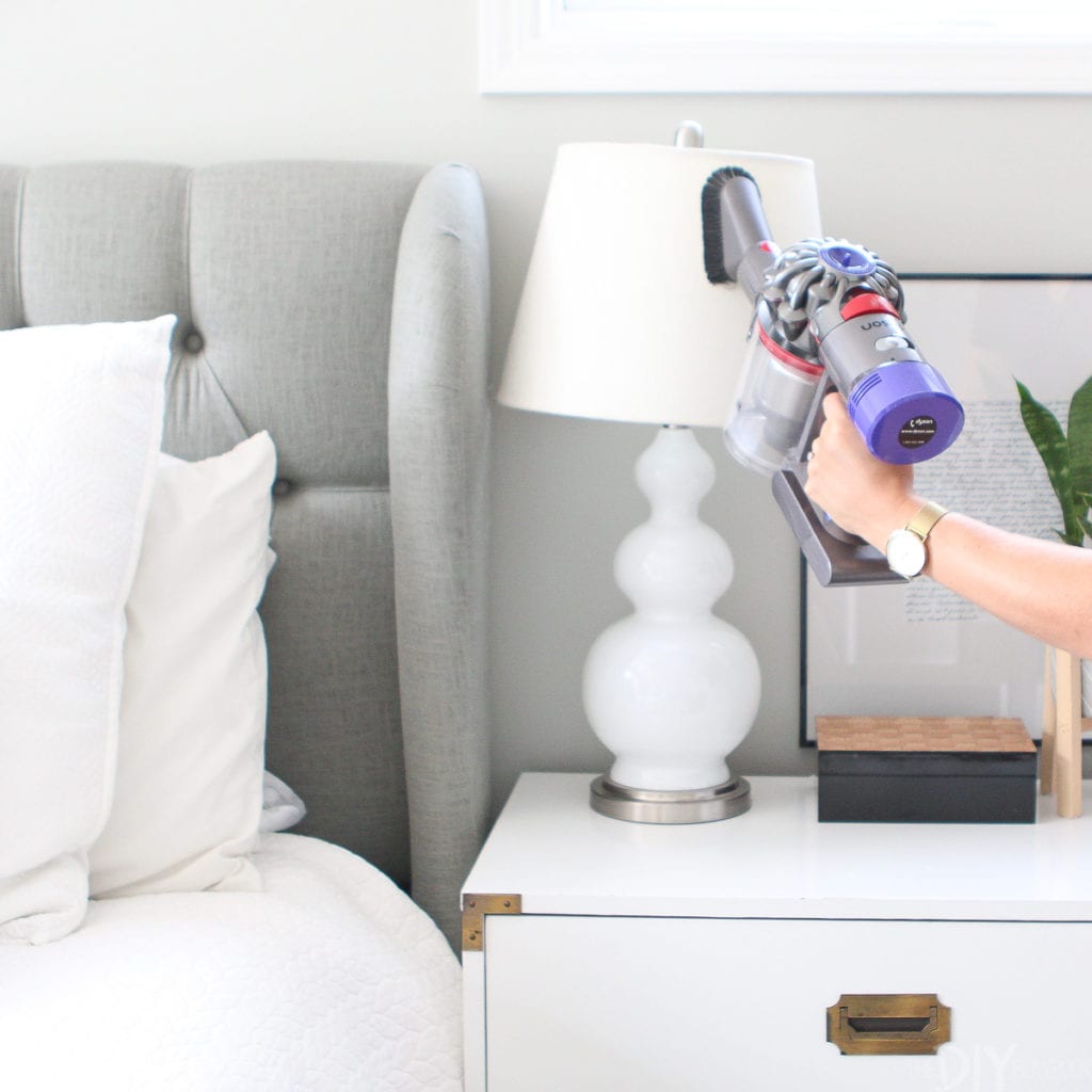 Vacuuming a lamp shade with a dyson vacuum