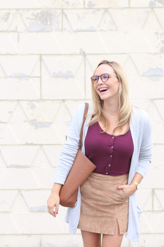 A maroon top with a tan suede skirt