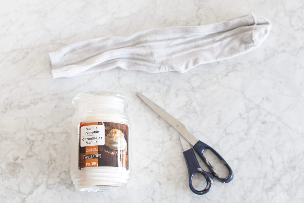 Using an old sock to make a fall candle holder