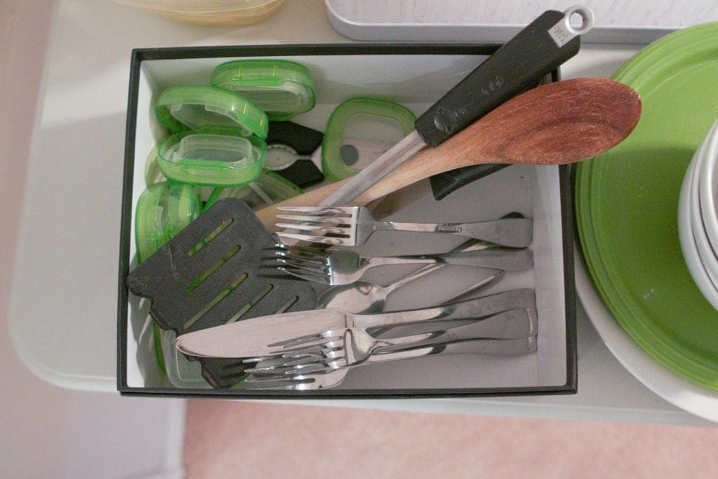clean silverware in a temporary kitchen