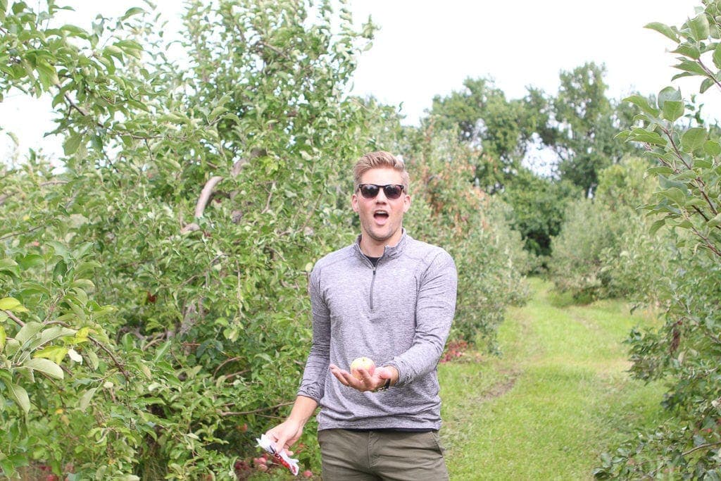 Finn juggling apples in the orchard