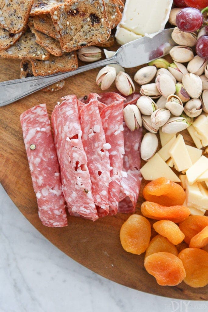 Roll up salami and prosciutto for a cheese board