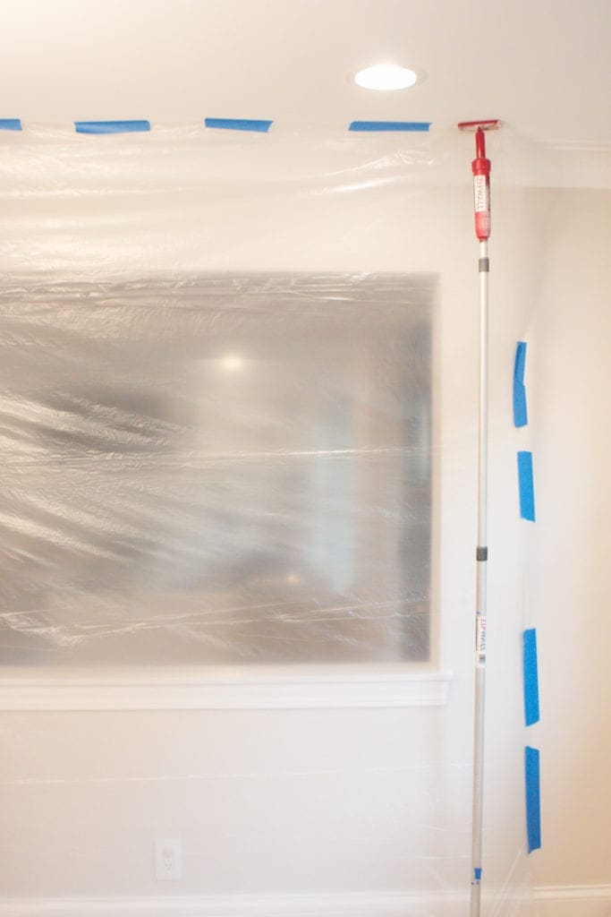 hanging plastic sheeting during kitchen demo