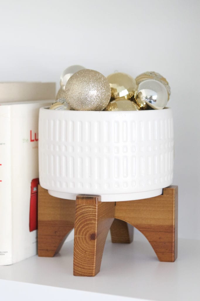 planter filled with gold ornaments 