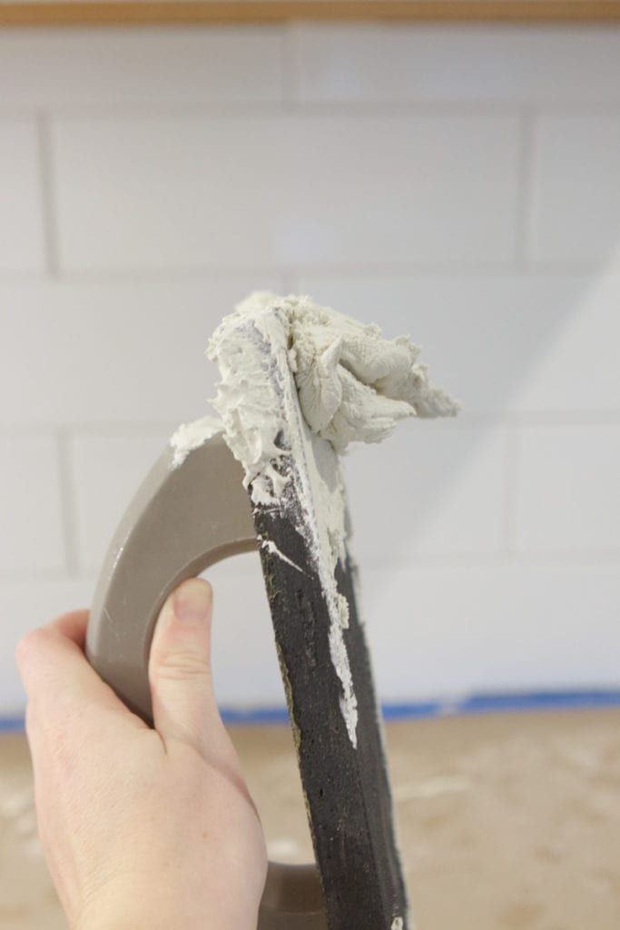step by step tutorial on how to grout backsplash tile