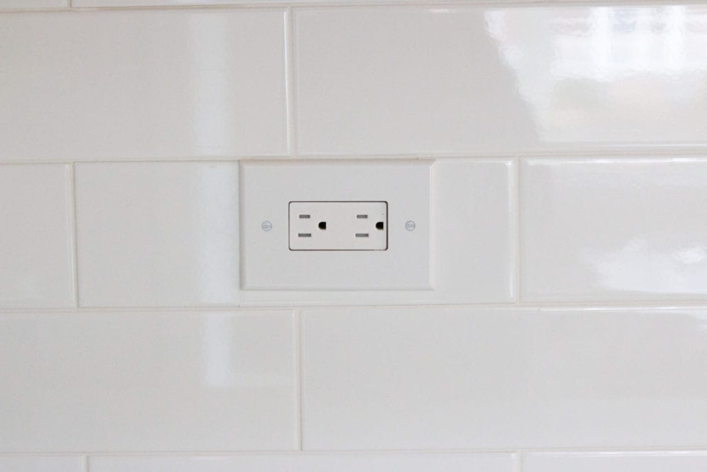 DIY backsplash tile around an outlet